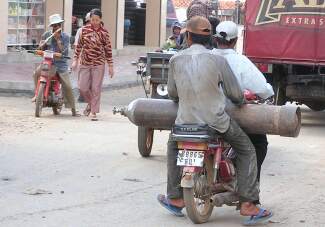 An acetylene tank carried on a motorcycle