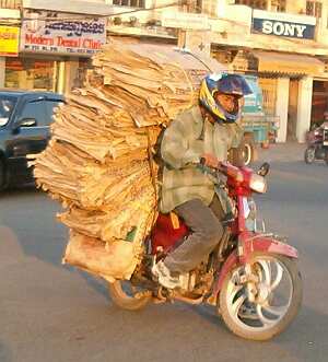 Motorcycle with a load of cardboard