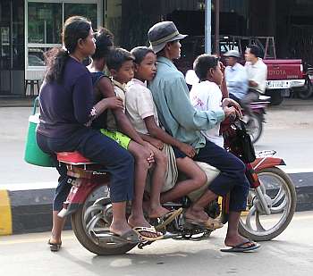 Six passengers on a motorcycle