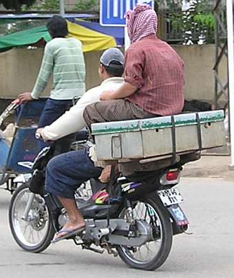 Delivering fish by motorcycle