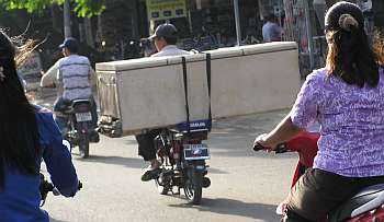 Motorcycle carrying a refrigerator
