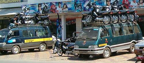 Motorcycles on top of vans
