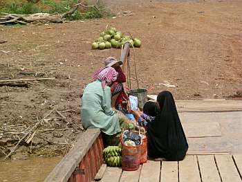 Muslim women bargaining on a ferry