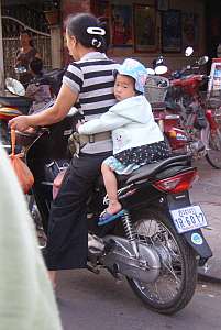 Toddler riding pillion