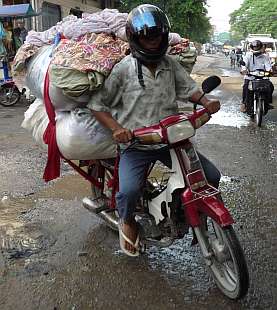 Load of clothes on a motorcycle