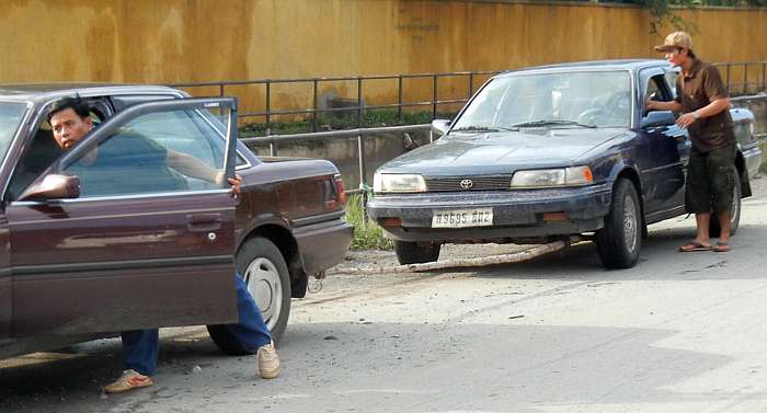 Towing a car with bamboo pole