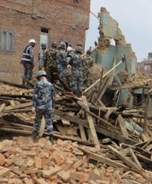 Description: C:\Users\hbrown\Pictures\Nepal\armed police taking down a house.jpg